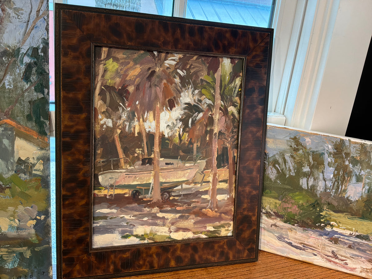 Framed palms with boat
