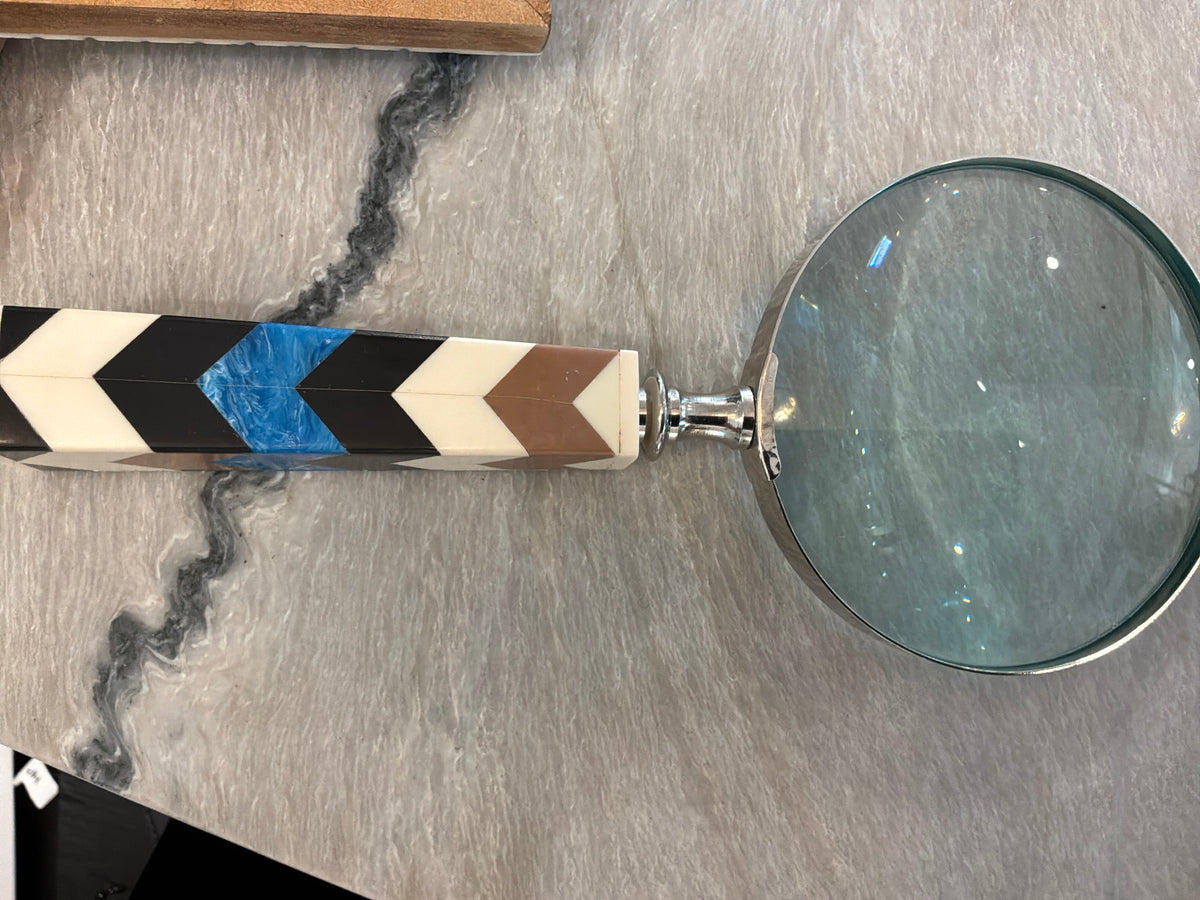 Blue chevron magnifying glass